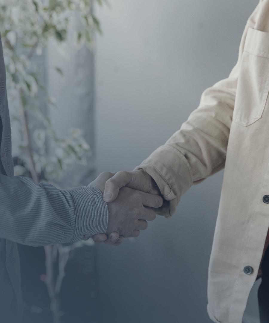 An attorney and client shaking hands