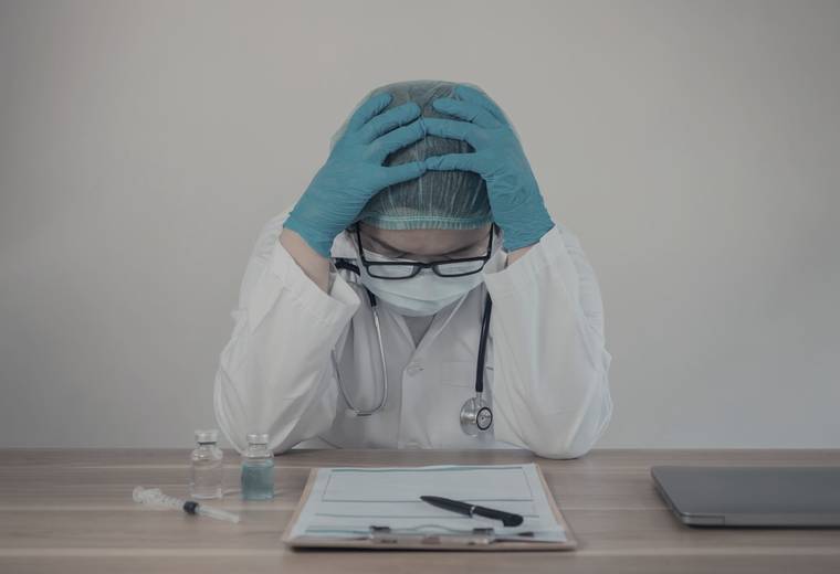 A physician reviewing a patient's chart